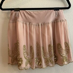 Blush mesh mini skirt with gold beading